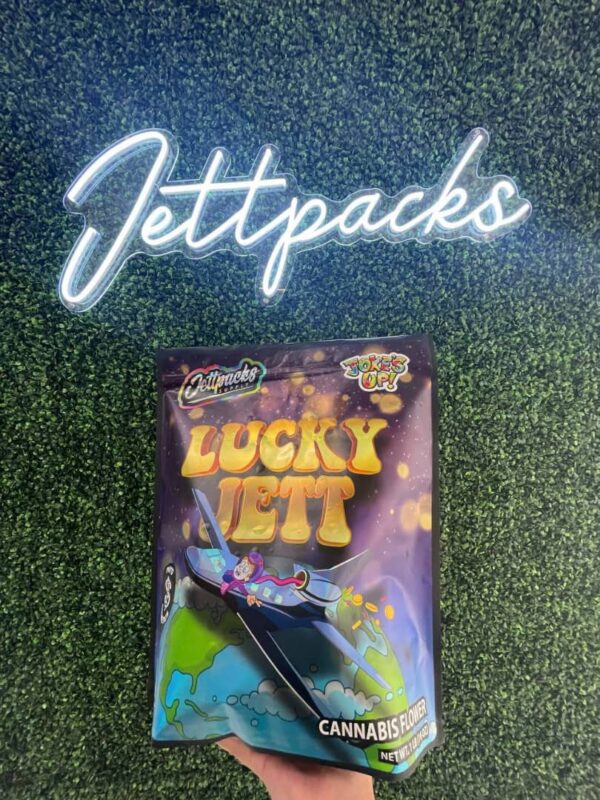 Lucky Jett cannabis strain with bags – Premium buds for a smooth, flavorful experience, perfect for relaxation and creativity.