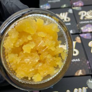 A jar of Persy Diamonds, showcasing the clear, crystalline cannabis concentrate, ready to provide a potent experience.